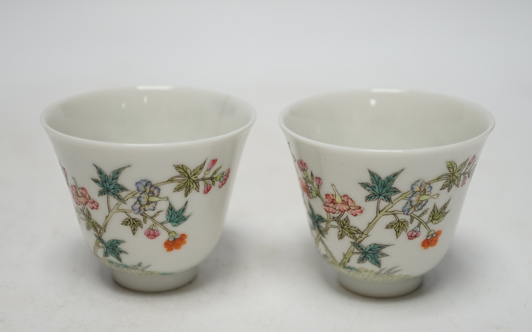A pair of Chinese porcelain wine cups, 5.3cm high